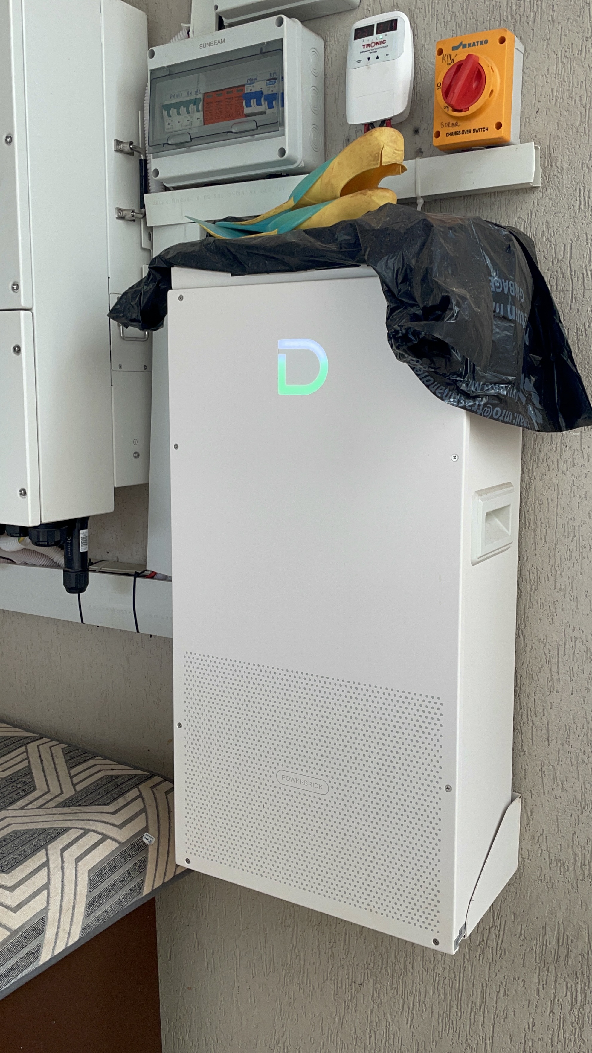 Power backup battery unit mounted in the service area with control switch and electric panel.
